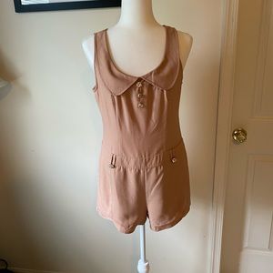 Beige/nude colored romper.